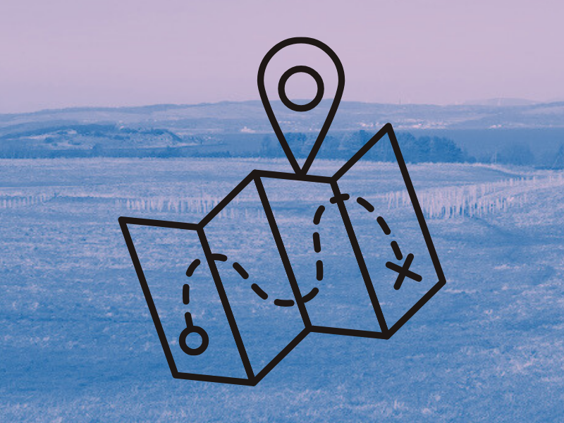 The farm landscape with a blue/purple colour wash over it, and superimposed, a graphic of a map with a dashed line path and a 'pin' symbolising a route