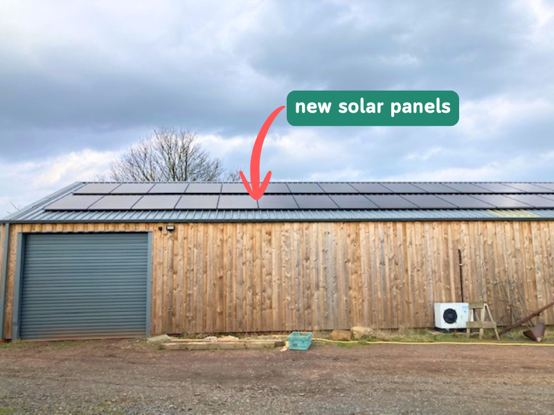 Website800x600px Solar with label A photo of the market garden pack shed with neat solar panels installed on the sloping roof