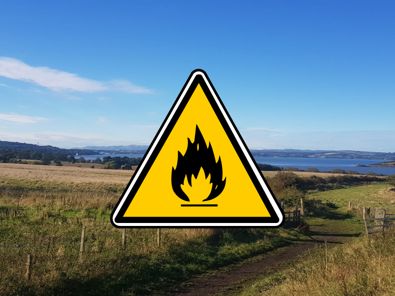 Website800x600px Fire Safety A photo of the farm landscape, with a fire warning symbol (yellow triangle) imposed on top